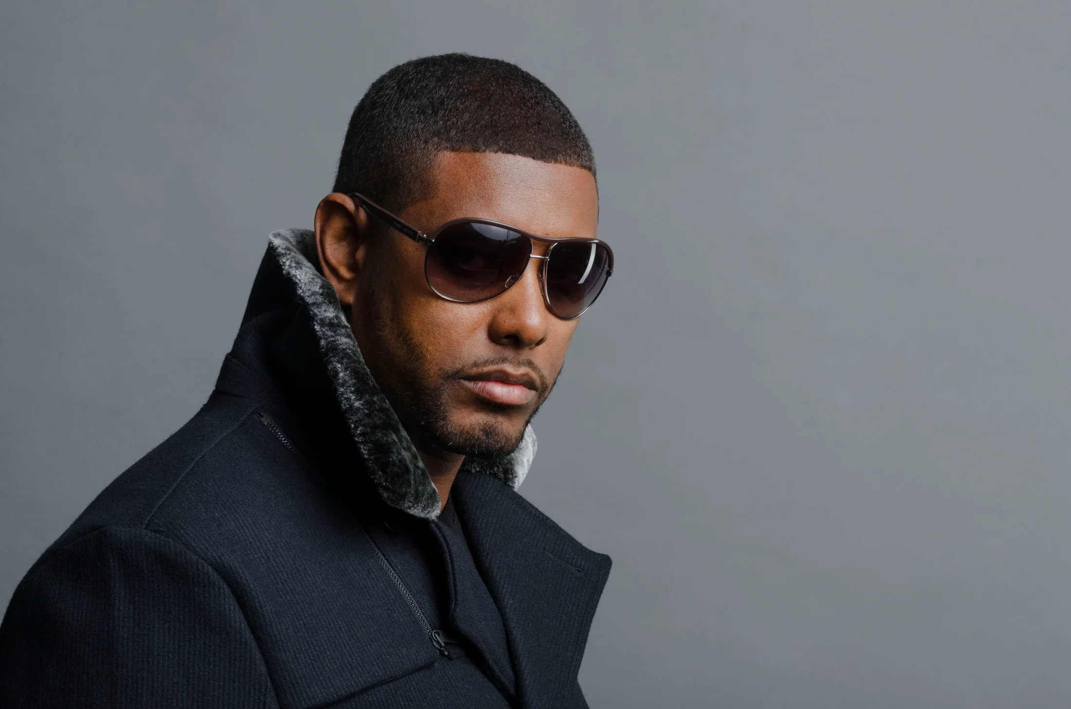 Garland Shields in a dark coat and sunglasses